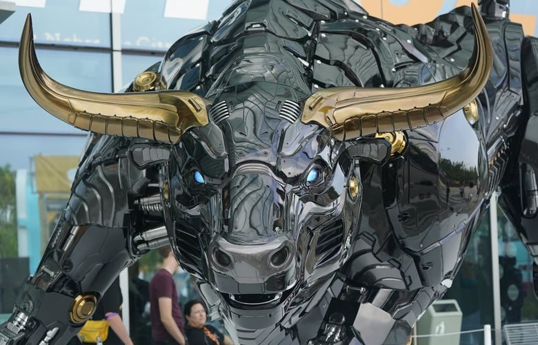 The Miami Bull is shown, Wednesday, April 6, 2022, at the Miami Beach Convention Center in Miami Beach, Fla. The robot-like statue of a bull is meant to emulate Wall Street’s “Charging Bull,” and was unveiled to kick off the Bitcoin 2022 conference. (AP Photo/Wilfredo Lee) OTK OTK