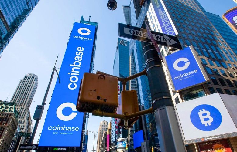 Coinbase signage is shown during the company’s initial public offering at the Nasdaq MarketSite in New York in 2021. (Michael Nagle / Bloomberg)