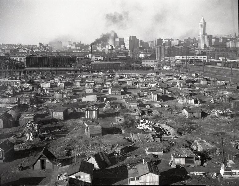 Seattle’s largest Hooverville was home to around 1,500 people and located south of Pioneer Square, next to the city’s largest garbage dump. People formed community there, starting their own volunteer fire department and establishing addresses. The people who lived there were pushed out, and the Hooverville was burned to the ground in 1941. (The Seattle Times file)