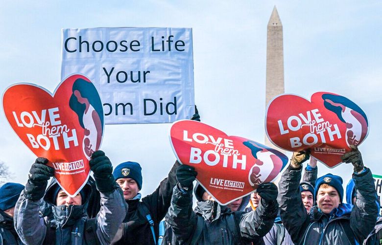 WASHINGTON, DC – JANUARY 21: People attending the annual Pro-Life gathering, March for Life, on gather on the National Mall on Friday, Jan. 21, 2022 in Washington, DC. (Kent Nishimura / Los Angeles Times) 44744009W