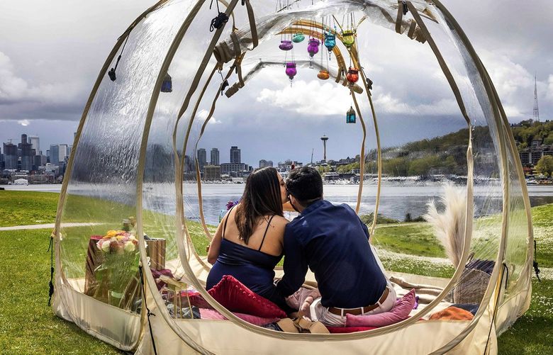 Shaily Panchigar, 30, kisses boyfriend Neil Choksi, 30, during a romantic date under a clear tent at Gas Works Park in Seattle on April 9, 2022. ìIt just feels amazing ó  it feels like the moment should just pause. So we can live this forever,î said Panchigar. Choksi describes his delight for the great weather Saturday afternoon. 
óó
Side note: 
Choksi set up the date through Seattle Luxury Picnics.