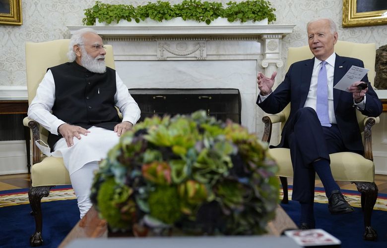 FILE – President Joe Biden meets with Indian Prime Minister Narendra Modi in the Oval Office of the White House, Sept. 24, 2021, in Washington. President Biden is set to speak with Indian Prime Minister Modi, Monday, April 11, 2022 when the two will virtually discuss the Ukraine war and other matters. India has earned Russian praise by maintaining a neutral stance in the war. India abstained when the U.N. General Assembly voted Thursday to suspend Russia from its seat on the 47-member Human Rights Council over allegations that Russian soldiers in Ukraine engaged in rights violations that the U.S. and Ukraine have called war crimes.  (AP Photo/Evan Vucci, file) NYPS202 NYPS202