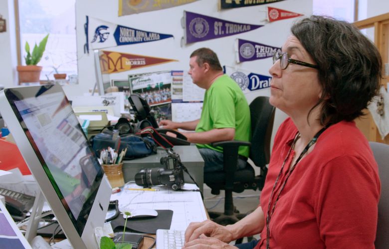 Dolores Cullen, a photographer and member of the family that publishes the Storm Lake Times Pilot at the newspaper office, in a still from the 2021 documentary “Storm Lake.”