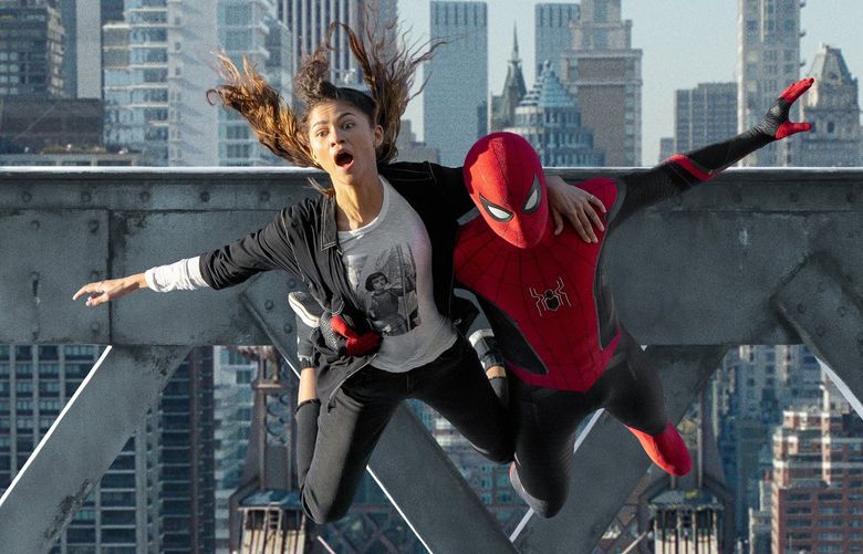 MJ (Zendaya) and Spider-Man (Tom Holland) jump off a bridge in “Spider-Man: No Way Home.” (Matt Kennedy/Sony Pictures/TNS) 45070115W 45070115W