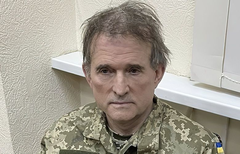 In this image provided by the Ukrainian Presidential Press Office, oligarch Viktor Medvedchuk, who is both the former leader of a pro-Russian opposition party and a close associate of Russian leader Vladimir Putin, sits handcuffed after being detained in a special operation carried out by the country’s SBU secret service, Tuesday, April 12, 2022, in Ukraine. (Ukrainian Presidential Press Office via AP) DCJE504 DCJE504
