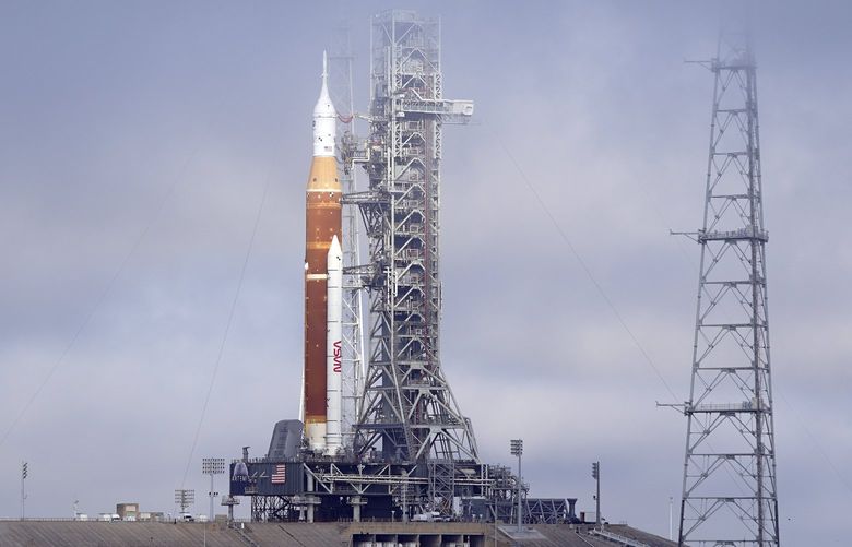 FILE -The NASA Artemis rocket with the Orion spacecraft aboard stands on pad 39B at the Kennedy Space Center in Cape Canaveral, Fla., March 18, 2022. After a series of equipment problems, NASA attempted an abbreviated fueling test of its mega moon rocket Thursday, April 14, 2022 at Florida’s Kennedy Space Center. (AP Photo/John Raoux, File) NYPS204 NYPS204