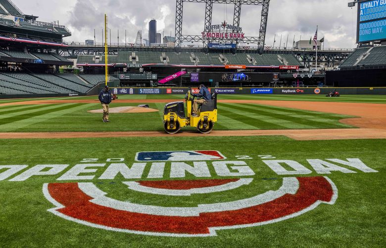 Members of the ground crew prepare the field at T-Mobile Park in Seattle on Thursday, April 14, 2022. Friday is “Opening Day” for the Seattle Mariners and will be playing against the Houston Astros.