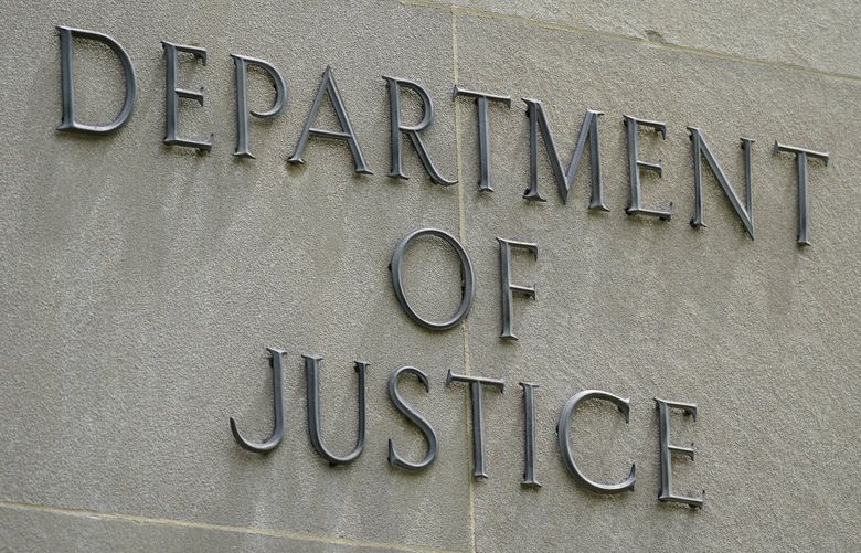 FILE – An exterior sign is photographed outside the Robert F. Kennedy Department of Justice building in Washington on May 4, 2021. President Joe Biden is nominating six lawyers to run U.S. attorney’s offices across the country, a diverse group of candidates in the latest picks for the top law enforcement positions. The nominees, being announced by the White House on Wednesday, Jan. 26, 2022, would run the federal prosecutors’ offices in Connecticut, Utah, Montana, Alaska, New Mexico and New Hampshire. (AP Photo/Patrick Semansky, File)