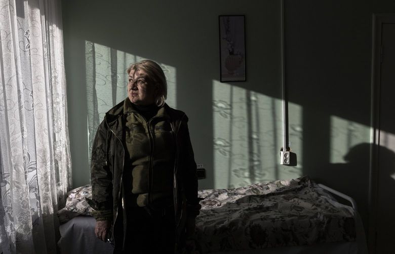 Maryna Hanitska, the director of a special care home, inside a room at the mental health facility in Borodyanka, Ukraine, on Thursday, April 14, 2022. Hanitska spied on the Russian soldiers occupying the home when she wasn’t scrambling to feed the residents and shepherd them to safety during shelling.  (David Guttenfelder/The New York Times) XNYT126 XNYT126