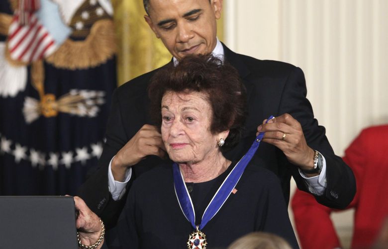 FILE – President Barack Obama presents Jewish Holocaust survivor Gerda Weissmann Klein, a 2010 Presidential Medal of Freedom on Feb. 15, 2011, during a ceremony in the East Room of the White House in Washington. Gerda Weissmann Klein, a Holocaust survivor and author who wrote about her ordeal and went on to receive the Presidential Medal of Freedom, will be remembered at a memorial May 1 after her death in Phoenix earlier this month. Klein died April 3, 2022 in Phoenix, where she had lived since 1985. She was 97. (AP Photo/Carolyn Kaster, File) LA553 LA553