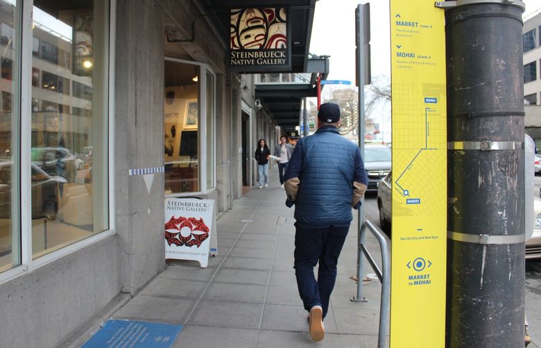 The Market to MOHAI corridor has two signatures, both in blue and yellow: History blades affixed to light poles with photos and descriptions, as well as tiles embedded in the sidewalk featuring literary excerpts.