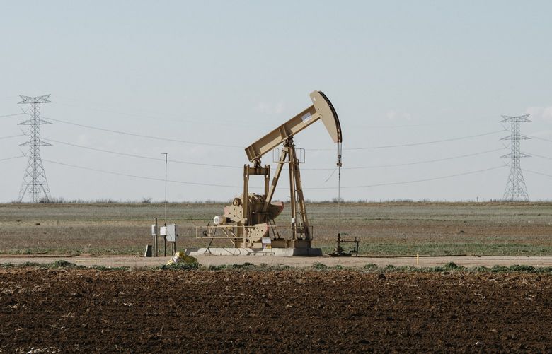 FILE — A pump jack in an agricultural field near Stanton, Texas, on Feb. 21, 2019. The Biden administration announced on Friday, April 15, 2022, that it would resume selling leases for new oil and gas drilling on public lands, but would also raise the federal royalties that companies must pay to drill, the first increase in those fees in more than a century. (Brandon Thibodeaux/The New York Times)
