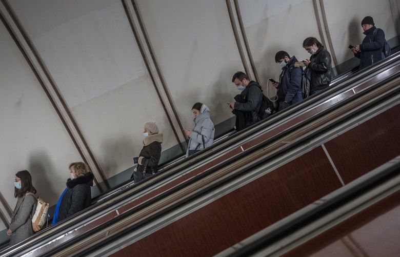 FILE – Subway commuters on their mobile devices in Moscow, Feb. 26, 2022. Telegram has become the platform of choice for Russians seeking to escape Moscow’s propaganda web, but can it last? (Sergey Ponomarev/The New York Times)