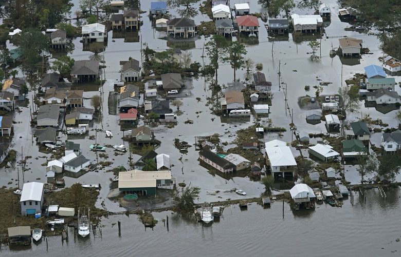 FILE – Floodwaters slowly recede in the aftermath of Hurricane Ida in Lafitte, La., about 25 miles south of New Orleans, Wednesday, Sept. 1, 2021. While many swaths of the country are at risk for flooding, the Louisiana coast has long been especially vulnerable. (AP Photo/Gerald Herbert, File) LAGH302 LAGH302