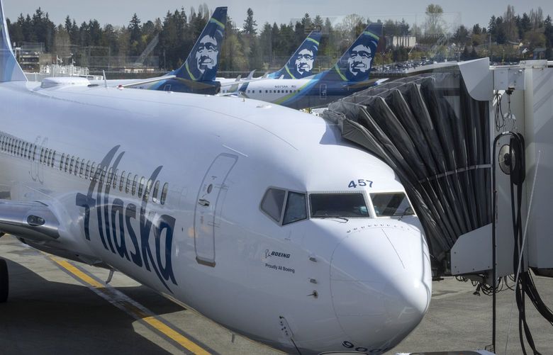 An Alaska Airlines jet is prepared for takeoff  at Seattle-Tacoma International Airport in SeaTac Thursday, April 7, 2022.  Expansion plans at Alaska Airlines have been hit by the reality of staff shortages and travel chaos. 220071