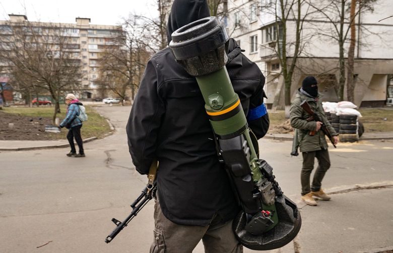 FILE – Ukrainian fighters – including one armed with an NLAW anti-tank weapon – in Kyiv on March 13, 2022. Washington and its allies are scouring Central Europe and the world to get Ukraine the weapons it needs for the next phase of the war.   (Lynsey Addario/The New York Times) -NO SALES – XNYT193 XNYT193