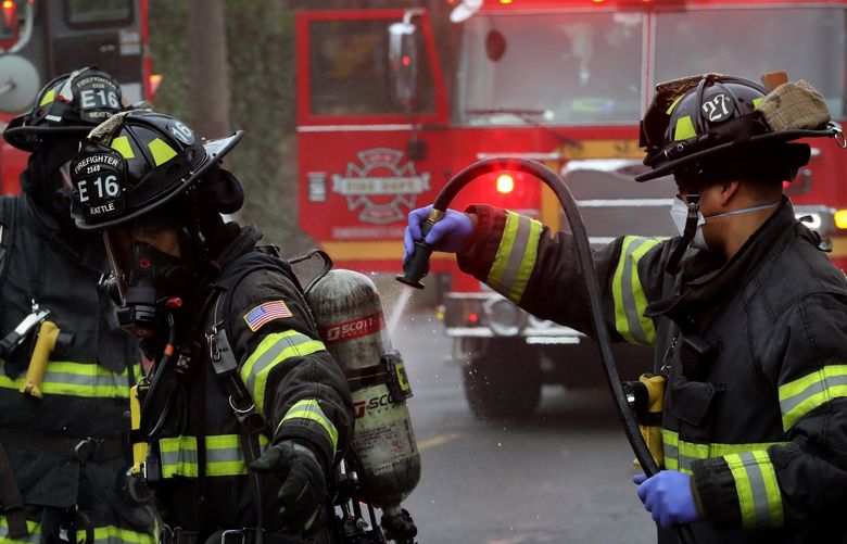 After emerging from a smokey house fire at 1107 N.W. 65th, a Seattle firefighter has breathing equipment washed off.

House fire at NW 65th.


LO House fire
Saturday Feb 5, 2022