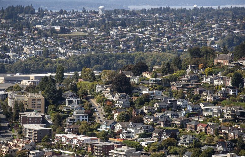 Queen Anne neighborhood in the foreground with Magnolia in the distance, seen from the Space Needle on Thursday, Sept. 16, 2021.