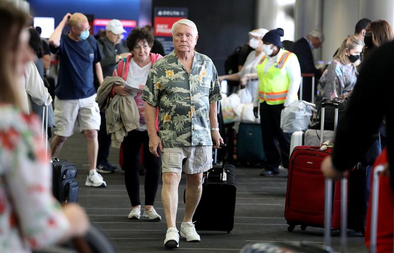 Passengers make their way through Delta Airlines Terminal 2 at Los Angeles International Airport on Tuesday, April 19, 2022, in Los Angeles. Airports and airlines dropped their mask requirements after a Florida federal judge voided the Biden administration’s mask mandate for planes, trains and buses. (Gary Coronado/Los Angeles Times/TNS) 45726271W 45726271W