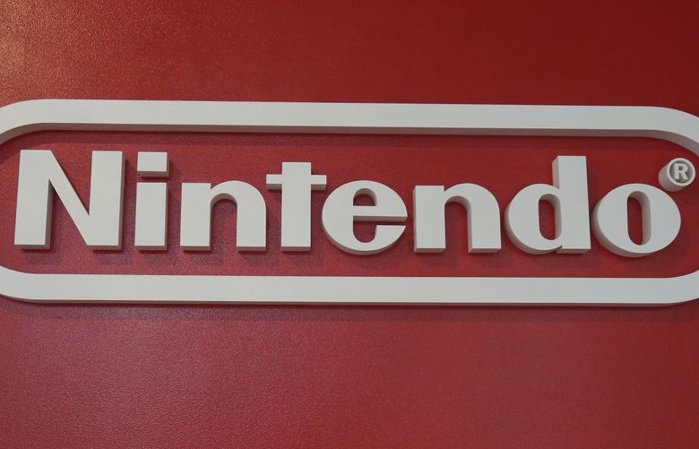 In this June 19, 2018, photo, a logo of Nintendo hangs at Panasonic center in Tokyo. Nintendo, the Japanese video game maker behind the Super Mario and Pokemon franchises, is reporting a 25 percent jump in fiscal third-quarter profit, boosted by the popularity of games for its Switch console. (AP Photo/Koji Sasahara)