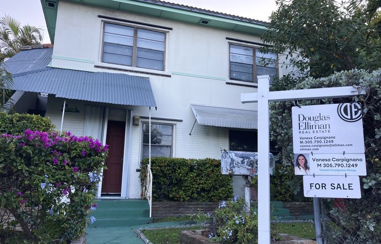 A house for sale is shown, Thursday, Dec. 9, 2021, in Surfside, Fla. (AP Photo/Wilfredo Lee)