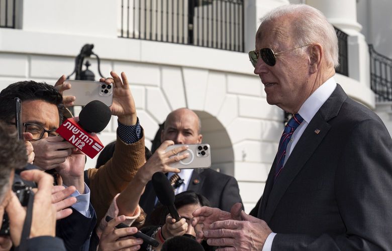 President Joe Biden speaks with reporters before boarding Marine One on the South Lawn of the White House, Wednesday, March 2, 2022, in Washington. Biden is en route to Wisconsin. (AP Photo/Alex Brandon)