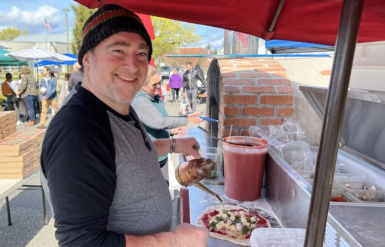 Chef Alfredo Russo has been bringing his mobile pizzeria to the Proctor Farmers’ Market for 13 years. Credit: Zach Powers