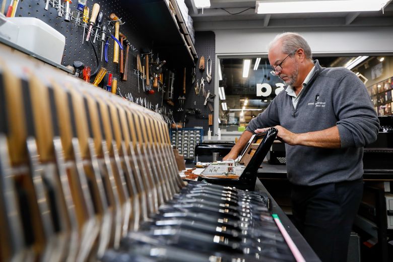 Joe Petosa Jr. puts the all-wood keys back in a Giulietti accordion after servicing it at his workshop in the back of the Petosa Accordions store in Lynnwood. Petosa is one of the last remaining accordion repair shops in the country, and Joe Petosa Jr. might be one of the only remaining technicians with the knowledge to service an accordion with all wood keys. (Jennifer Buchanan / The Seattle Times)