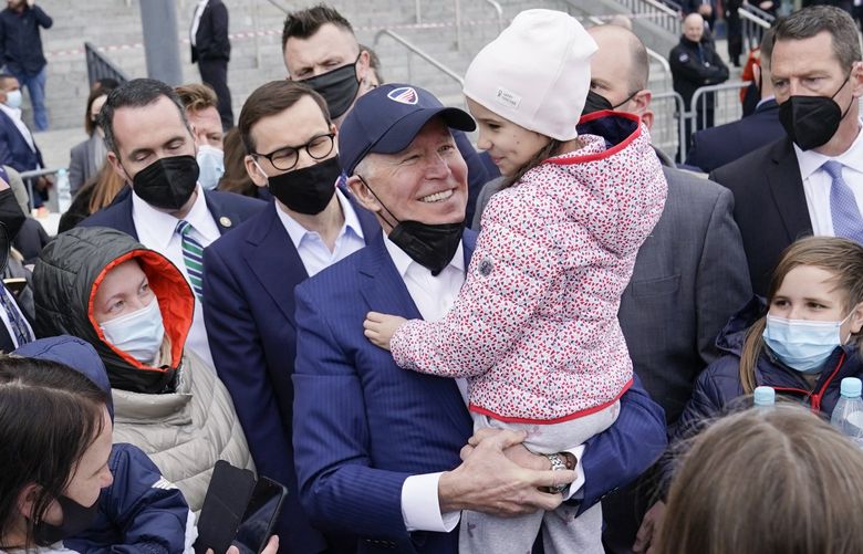 FILE – President Joe Biden meets with Ukrainian refugees during a visit to PGE Narodowy Stadium, March 26, 2022, in Warsaw. The Biden administration is making it easier for refugees fleeing Russiaâ€™s war on Ukraine to come to the United States from Europe while trying to shut down an informal route through Northern Mexico that has emerged in recent weeks.  (AP Photo/Evan Vucci, File) WX101 WX101