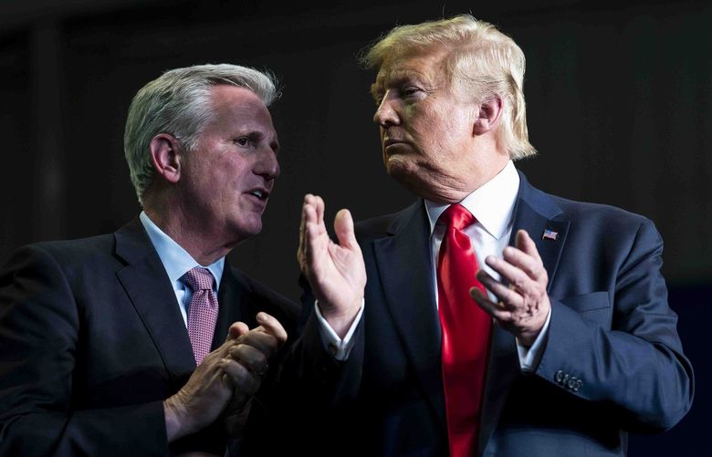 FILE – House Minority Leader Kevin McCarthy (R-Calif.) speaks to President Donald Trump during an event with rural stakeholders on water accessibility, in Bakersfield, Calif., Feb. 19, 2020. In the days after a mob incited by Trump attacked the capitol, McCarthy planned to ask Trump to resign. Mitch McConnell told allies impeachment was warranted. But their fury faded fast. (Doug Mills/The New York Times) XNYT3 XNYT3