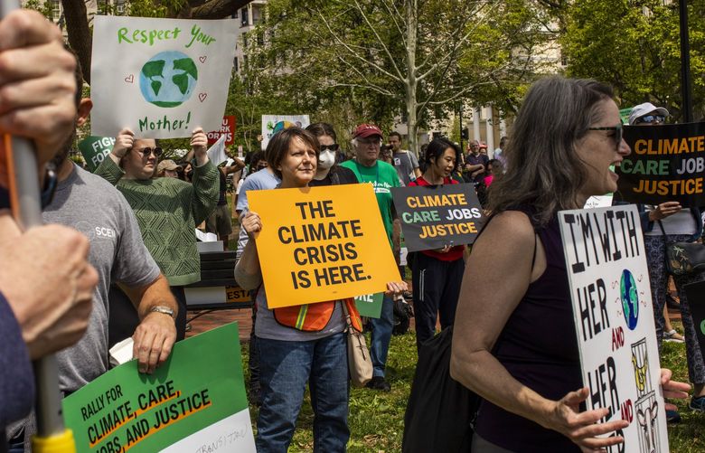 Demonstrators gather for the Fight for Our Future rally, at Lafayette Park in Washington, on Saturday, April 23, 2022. In Washington, D.C. as well as Phoenix, Atlanta and scores of other cities across the country, demonstrators on Saturday called on the government to enact bold climate action. (Jason Andrew/The New York Times) XNYT59 XNYT59