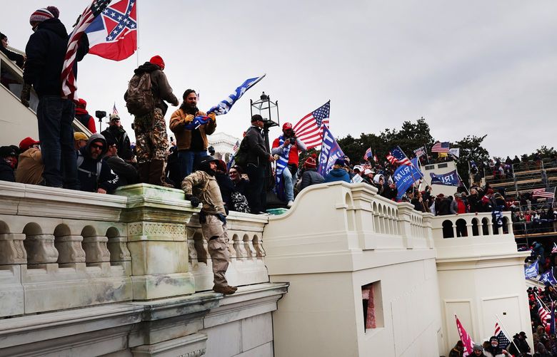 Thousands of Donald Trump supporters storm the United States Capitol building following a “Stop the Steal” rally, on Jan. 6, 2021, in Washington, D.C. (Spencer Platt/Getty Images/TNS) 45633092W 45633092W