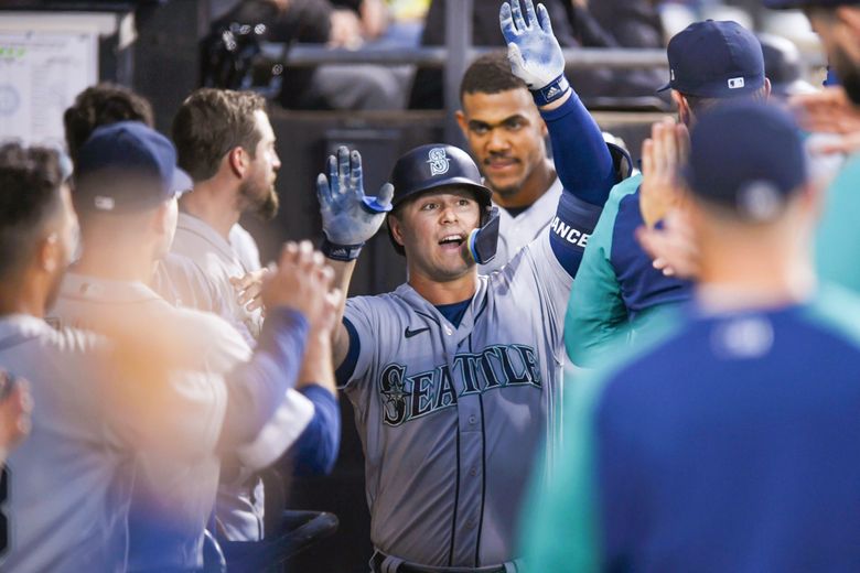 Ty France of the Seattle Mariners celebrates scoring a run with