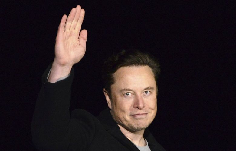 FILE – Elon Musk waves while providing an update on SpaceX’s Starship, Thursday, Feb. 10, 2022, near Brownsville, Texas. In April 2022, a group of Tesla shareholders suing Musk over some 2018 tweets about taking the company private is asking a federal judge to order him to stop commenting on the case. (Miguel Roberts/The Brownsville Herald via AP, File) TXBRH325