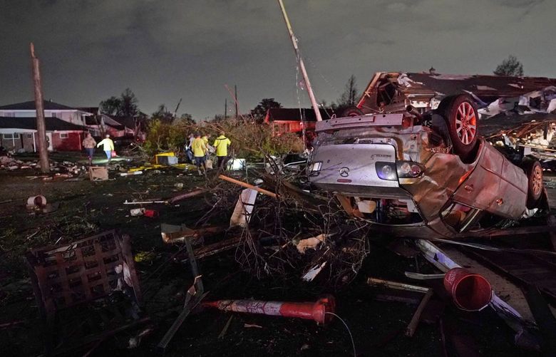 FILE – A car is flipped over after a tornado tore through the area in Arabi, La., Tuesday, March 22, 2022, in a part of the city that had been heavily damaged by Hurricane Katrina 17 years earlier. A United Nations report released on Monday, April 25, 2022, says disasters are on the rise are just going to get worse. A new UN report says the number of disasters, from climate change to COVID-19, are going to jump to about 560 a year by 2030. (AP Photo/Gerald Herbert, File) NY426 NY426