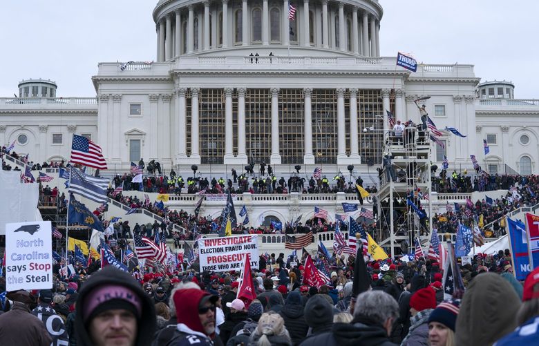 Supporters of President Donald Trump rally outside the U.S. Capitol on Wednesday, Jan. 6, 2021, in Washington. (AP Photo/Jose Luis Magana)