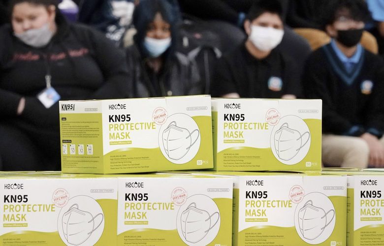 FILE – Boxes of KN95 protective masks are stacked together before being distributed to students at Camden High School in Camden, N.J., Wednesday, Feb. 9, 2022. According to a study by the Centers for Disease Control and Prevention released Tuesday, April 26, 2022,  three out of every four U.S. children have been infected with COVID-19.Â (AP Photo/Matt Rourke, File) NY429 NY429