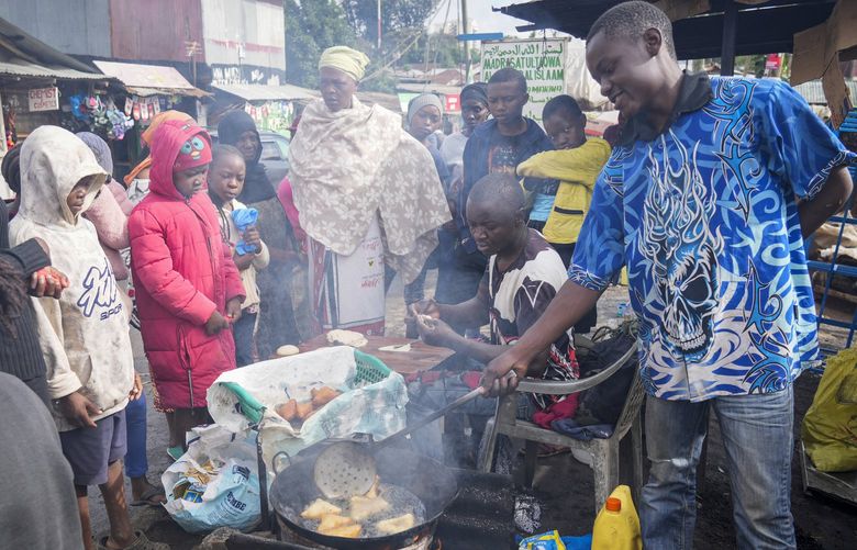 A man uses cooking oil to fry Mandazi, a type of fried bread, on a street in the low-income Kibera neighborhood of Nairobi, Kenya, Wednesday, April 20, 2022. Global cooking oil prices have been rising since the COVID-19 pandemic began and Russia’s war in Ukraine has sent costs spiralling. It is the latest fallout to the global food supply from the war, with Ukraine and Russia the worldâ€™s top exporters of sunflower oil. And it’s another rising cost pinching households and businesses as inflation soars. (AP Photo/Khalil Senosi) LGK101 LGK101