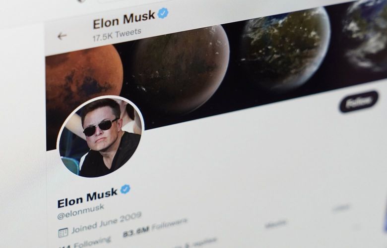 The Twitter page of Elon Musk is seen on the screen of a computer  on  April 25, 2022.  (AP Photo/Eric Risberg) 