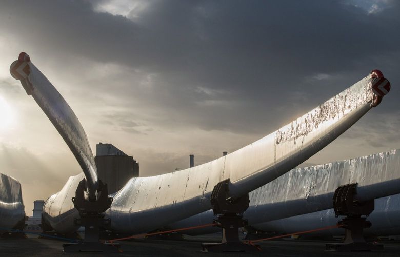 Wind turbine blades at the Siemens Gamesa Renewable Energy SA plant at the Port of Le Havre in Le Havre, France, on Monday, April 11, 2022. French government coffers are getting a boost from renewable energy as record power prices reduce state subsidies and even trigger reimbursements from the industry, the country’s wind trade group said. Photographer: Nathan Laine/Bloomberg