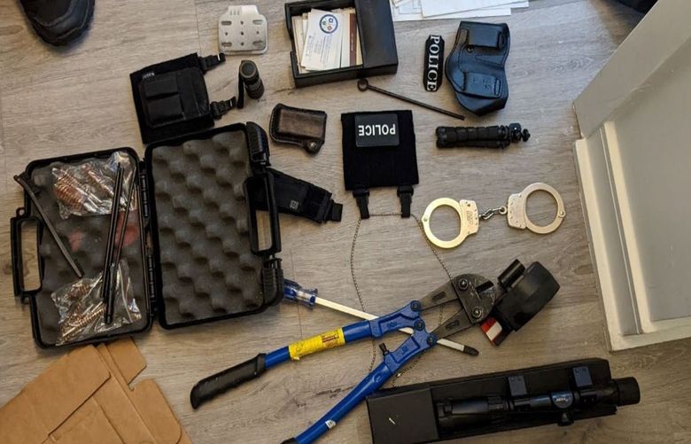 Prosecutors say this photo shows items from the apartment of Arian Taherzadeh including a rifle scope, tactical gear and storage equipment, clothing and patches with police insignias, handcuffs, breaching equipment, and a cleaning kit for firearms. (Evidence photograph from Government’s Memorandum in Support of Motion for Detention file in the U.S. District Court for the District of Columbia)