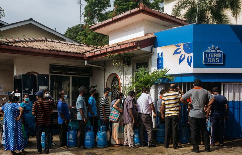 Residents queue for liquefied petroleum gas (LPG) in Colombo, Sri Lanka, on April 12, 2022.