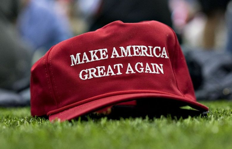A “Make America Great Again” hat sits on the ground ahead of a speech by U.S. President Donald Trump, not pictured, during a rally in Washington, Michigan, U.S., on Saturday, April 28, 2018.