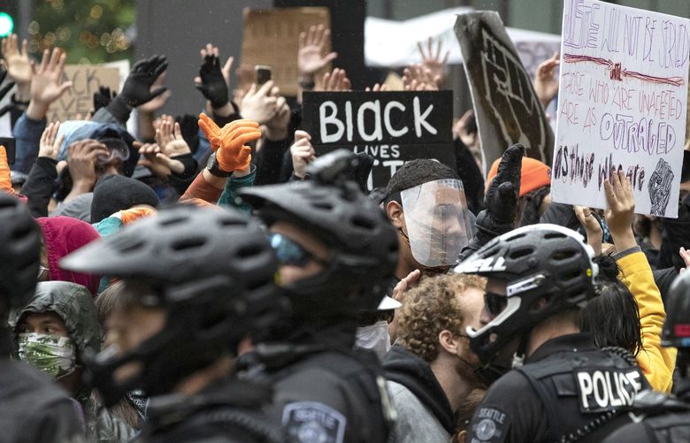 Protesters during a standoff with police in downtown Seattle. Police tried to get the group to move, as they were surrounded on both ends near Nordstrom.



Saturday, May 30, 2020