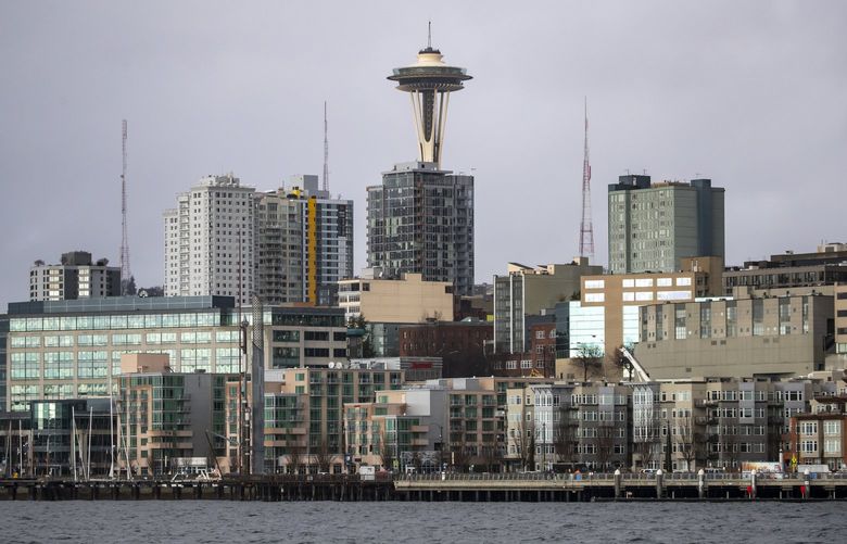 The Space Needle looms over the waterfront, seen from the Bremerton to Seattle ferry Saturday February 6, 2021.



 216337
