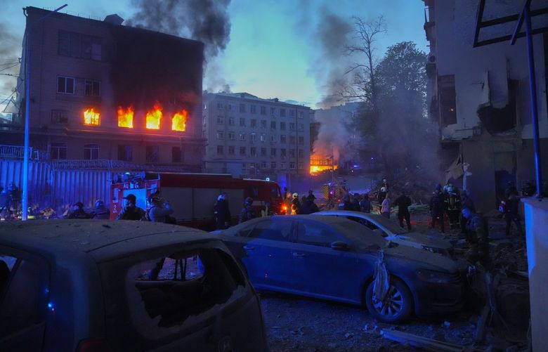 Firefighters put out a fire after a Russian rocket attack in Kyiv, Ukraine, Thursday, April 28, 2022. Russia mounted attacks across a wide area of Ukraine on Thursday, bombarding Kyiv during a visit by the head of the United Nations. (AP Photo/Efrem Lukatsky) XEL115 XEL115