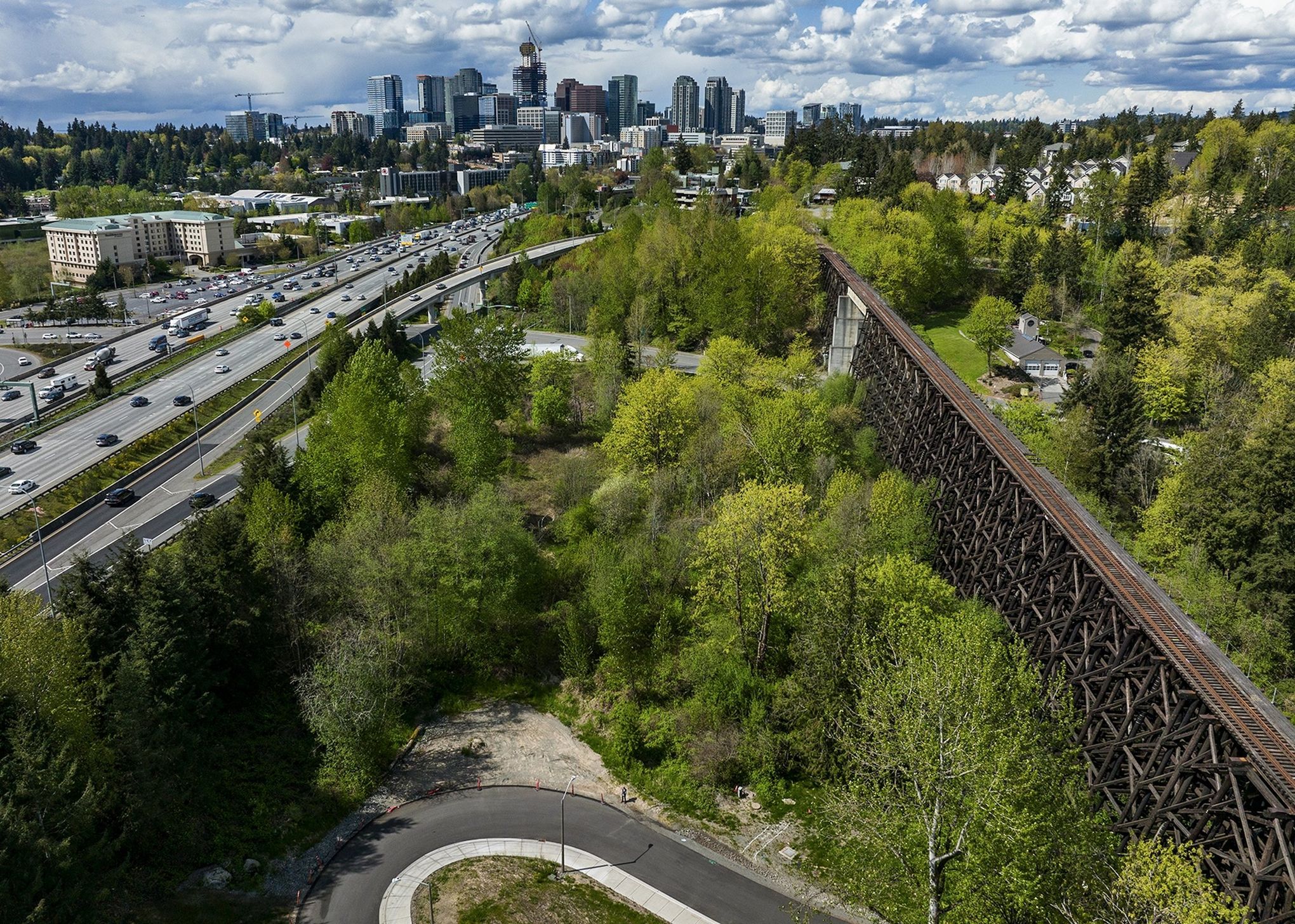The Wilburton trestle bridge is seen from the air with downtown Bellevue in the background