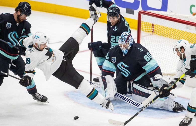 ­Adam Larsson, left, is called for interference on San Jose’s Logan Couture in the second period.  The 2-minute penalty put two Kraken players in the penalty box – and still San Jose couldn’t score on Chris Driedger.

The San Jose Sharks played the Seattle Kraken in the home season finale for the Kraken Friday, April 29, 2022 at Climate Pledge Arena, in Seattle, WA. 220172