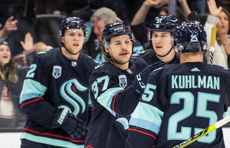 ­Yanni Gourde (center) gets the Kraken on the board first with a goal against San Jose in the first period.

The San Jose Sharks played the Seattle Kraken in the home season finale for the Kraken Friday, April 29, 2022 at Climate Pledge Arena, in Seattle, WA. 220172