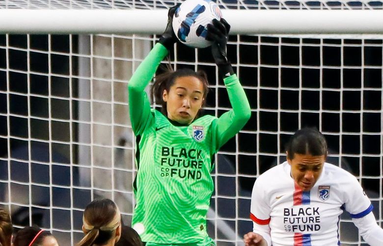 Lumen Field – OL Reign vs. Portland Thorns – Challenge Cup – 031822

OL Reign goalkeeper Phallon Tullis-Joyce makes a save on a corner kick during the first half Friday, March 18, 2022 in Seattle, Wash. 219873